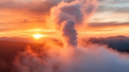 A vibrant and awe-inspiring sunrise lights up the sky with hues of orange, red, and yellow, casting dramatic shadows over a landscape filled with fluffy clouds.