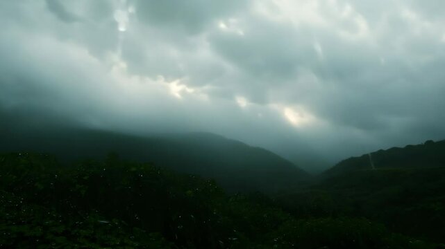 Timelapse. The scene starts at night and it's raining, and then it turns into A beautiful landscape with a bright sun shining through the clouds. And the rain stops. Timelapse in nature.