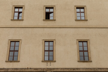 A minimalist facade with five wellplaced windows, emphasizing symmetry and intricate architectural details