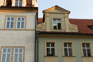 Fototapeta premium Explore and appreciate the stunning architecture of these charming historic buildings in warm evening light