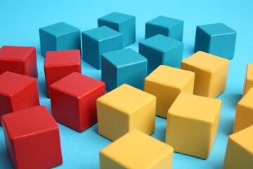 Obraz premium Many colorful cubes on light blue background