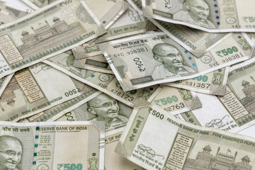 Indian currency 500 rupee bank note on white background, Five hundred Indian rupee bank paper currency note, Group of money stack of 500 Indian Rupee banknote.