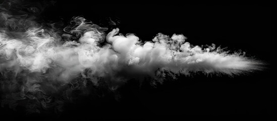White steam appears against a black backdrop providing copy space image