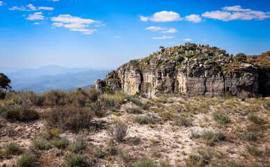 Breathtaking rocky landscape of Tundawala Angola under a clear blue sky with sparse vegetation in...