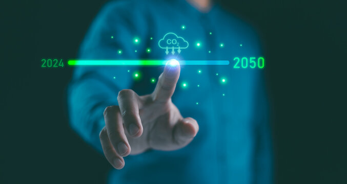 Businessman point to increasing arrow with carbon reduction for decrease CO2, Green house Global Economy concept. Carbon footprint and carbon credit to limit global warming from climate change.