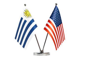 Table flags of United States and Uruguay on white background.