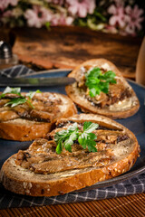 Slices of multigrain bread with sprats.