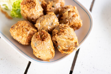 Crispy fried crab spring rolls. A delicious plate of golden fried snacks.