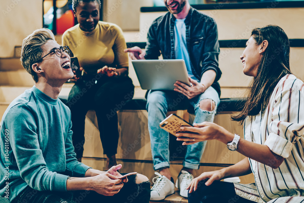 Aufkleber overjoyed young multiracial crew of students talking and having fun checking social networks updates