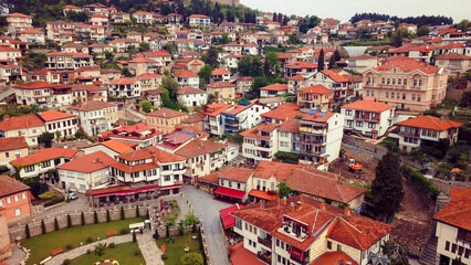 Aerial view of the charming old town of Ohrid in Macedonia with red roofed houses and lush greenery under a clear sky