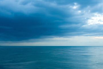 Blue sky with clouds over sea.