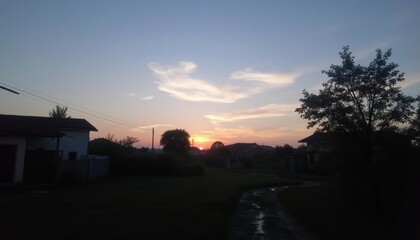 Obraz premium Sunset over a serene suburban street