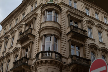 A beautifully detailed corner building showcasing ornate facades, charming balconies, and intricate designs