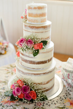 4 tier wedding cake with fresh flowers