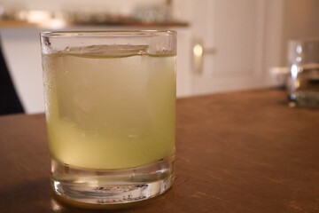 Refreshing Glass of Iced Lemonade on Wooden Table