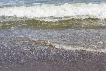 Waves Crashing on a Pebble Beach Shore