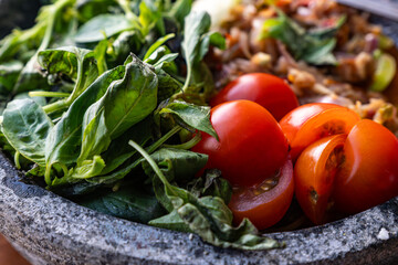 chili dip with fresh lemon basil, tomato and shallot, sambal pecak indonesian dish