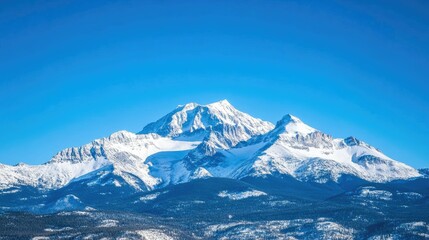 Obraz premium Snow-capped mountains in the Canadian Rockies with bright blue skies, leaving space for copy