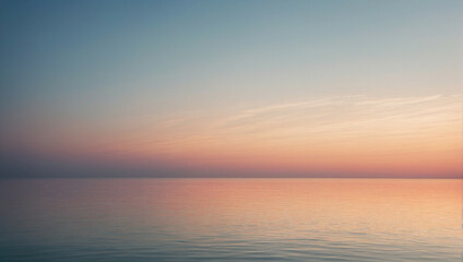 Fototapeta premium Tranquil sunset over a serene ocean with a soft gradient of colors reflecting in the water