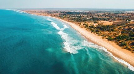 Obraz premium Top view of African coastline with a stretch of beach, leaving space for text in the water