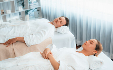 Caucasian couple customer enjoying relaxing anti-stress spa massage and pampering with beauty skin...