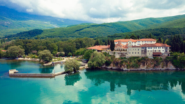 Sveti Naum Monastery by Lake Ohrid in Macedonia surrounded by lush greenery and serene waters on a clear day