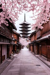 Fototapeta premium Tranquil Cherry Blossom Archway Five-Tiered Pagoda in Traditional Japanese Street