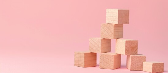 A message of making things easy on wooden blocks against a pink backdrop symbolizing simplicity with a copy space image available