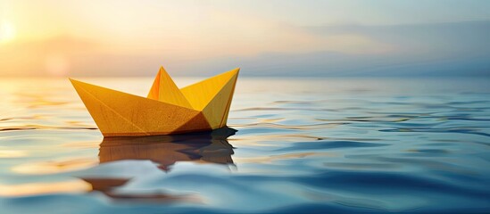 Innovative business concept with a yellow paper ship for new ideas and creativity in a copy space image