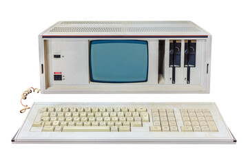Vintage eighties portable desktop computer with crt display and floppy drives