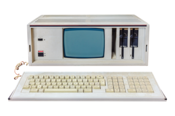Vintage eighties portable desktop computer with crt display and floppy drives