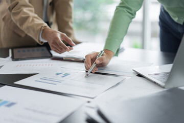Alternative energy environment businesspeople checking document and discuss about renewable energy