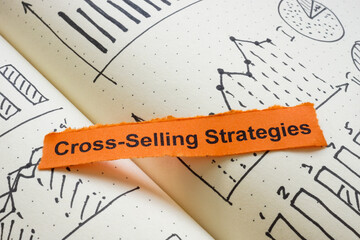 Notebook with the phrase cross-selling strategies.
