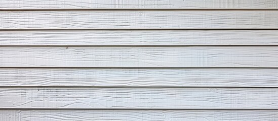 Obraz premium White vinyl siding with a wood grain texture in focus offering a backdrop with patterns and a frame for a copy space image