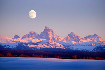 Sunset Light Alpen Glow on Tetons Teton Mountains wtih Moon Rising Grant Teton Idaho Side
