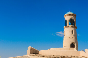 Obraz premium Exploring the historic lighthouse of Sur Oman under a clear blue sky during the day