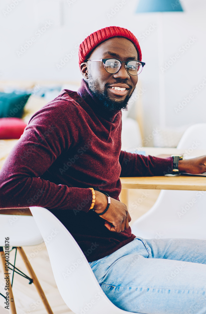 Poster portrait of african american hipster guy enjoy new software for netbook with mock up screen working 