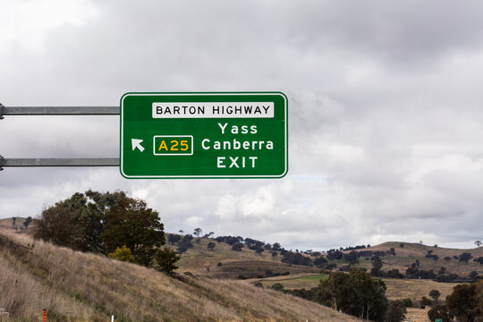 Green sign above road to Barton Highway Yass Canberra EXIT A25