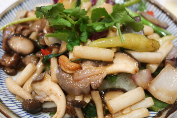 close up of Chinese Taiwanese dish of stir fried beef with green peper, onion and mushroom