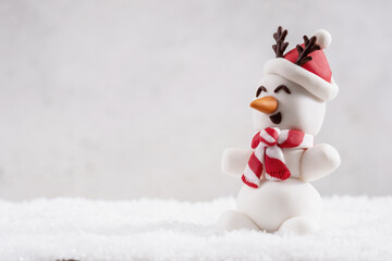 Happy funny marshmallow snowmans on snow