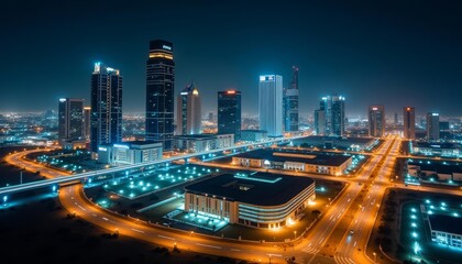 Obraz premium Bright cityscape at night illuminated by lights and neon