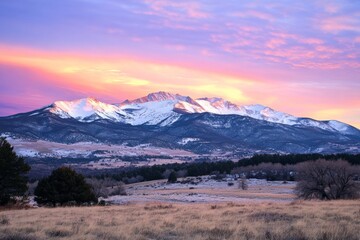 Fototapeta premium A calm winter morning with snow-covered mountains under soft pastel sunrise hues, creating a peaceful and serene landscape that captures quietude and beauty.