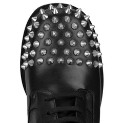 Close up of black boot toe with silver studs