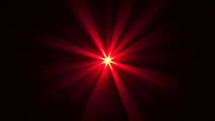 Abstract red star burst glowing with bright energetic light rays