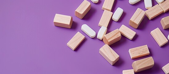 Bladder Cancer concept portrayed with wooden blocks on a purple background featuring pills conveying a medicine and Bladder Cancer theme alongside copy space image