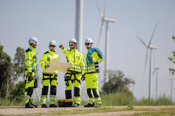 Engineers are having a discussion at wind turbine field