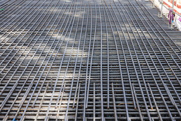 installing reinforcement mesh in construction site
