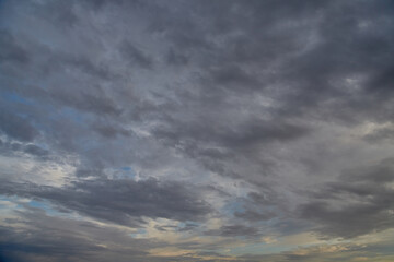 Panoramic view of the sky with gray clouds covering it, sky background.