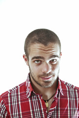 Obraz premium Young man with bearded face is posing on white background