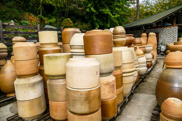 many ceramic products on a rack pallet, plates, vases, pots, master class, workshop, potter, study, tour, plant entertainment, landscape